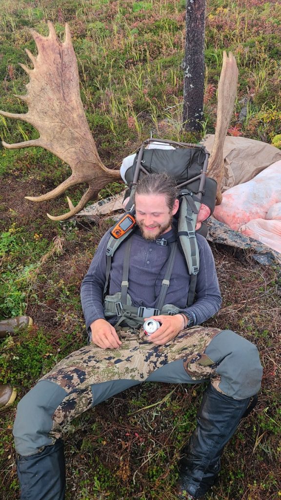 Moose Hunter taking a break after a successful hunt with Alaska Big Game Hunting